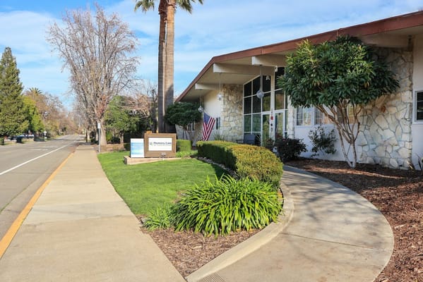 Exterior view of the assisted living facility with landscaping