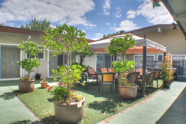Outdoor garden area with seating and tables