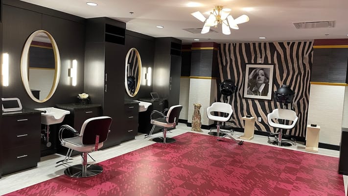 Interior view of a hair salon with styling stations