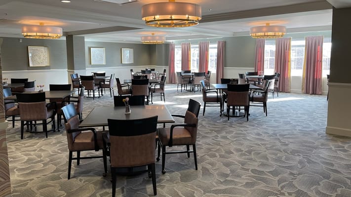 Bright dining area with tables and chairs