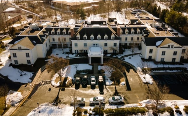 Aerial view of the facility building with snowy surroundings