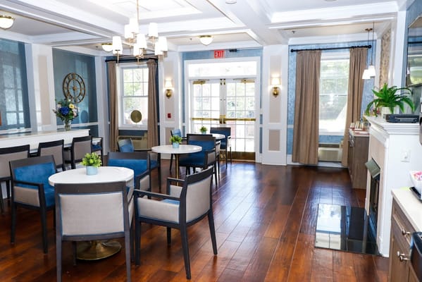 Bright common area with tables and chairs