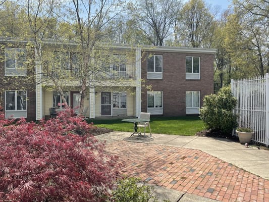 Outdoor seating area with landscaped gardens