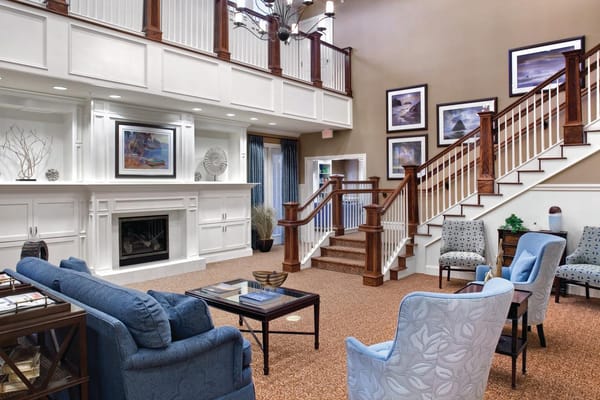 Spacious common area with comfortable seating and artwork