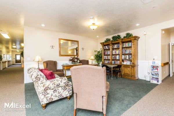 Cozy common area with seating and bookshelves