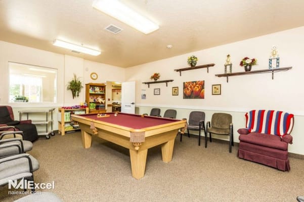 Interior common area with a pool table and seating