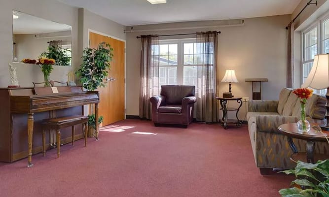 Interior common area with seating and piano