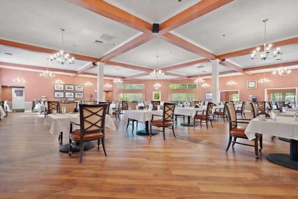 Bright dining room with tables set for meals