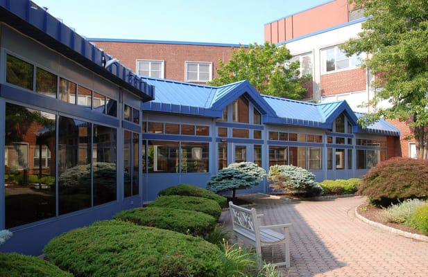 Outdoor courtyard with landscaped gardens and seating