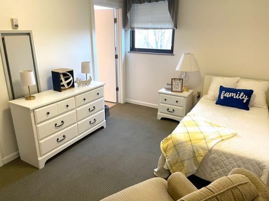 Cozy resident room with personal touches and furniture