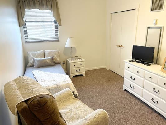 Cozy resident room with a bed and furniture