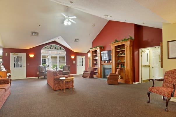 Cozy common area with seating and bookshelves