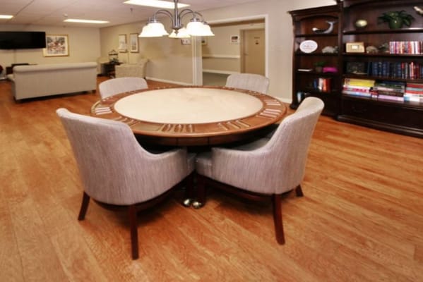 Dining table with six chairs in a communal area