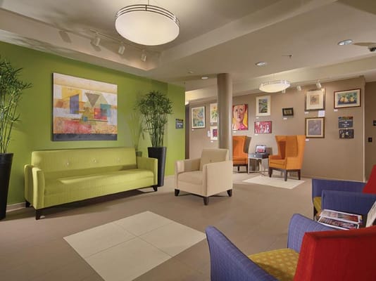 Colorful common area with seating and artwork