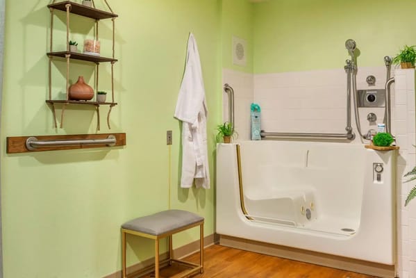 Accessible bathing area with grab bars and seating