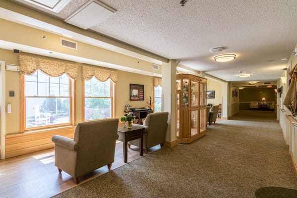 A well-lit common area with seating and decor
