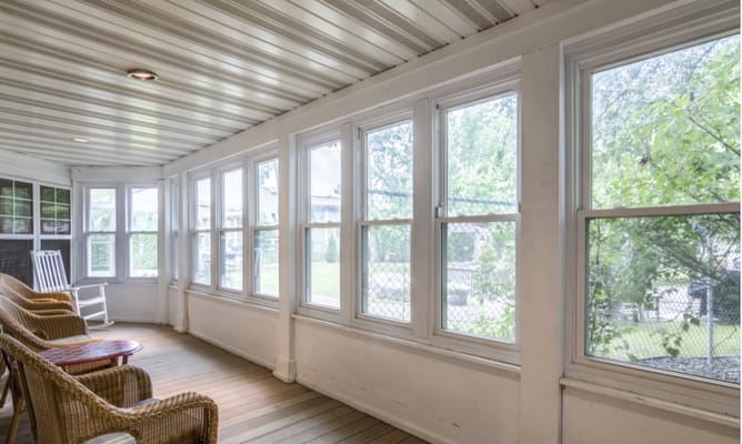 Sunroom with seating and large windows