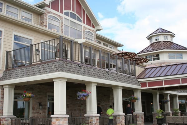 Exterior view of a senior living facility with a balcony