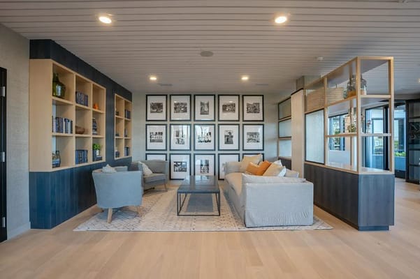 Interior common area with seating and photographs on the wall