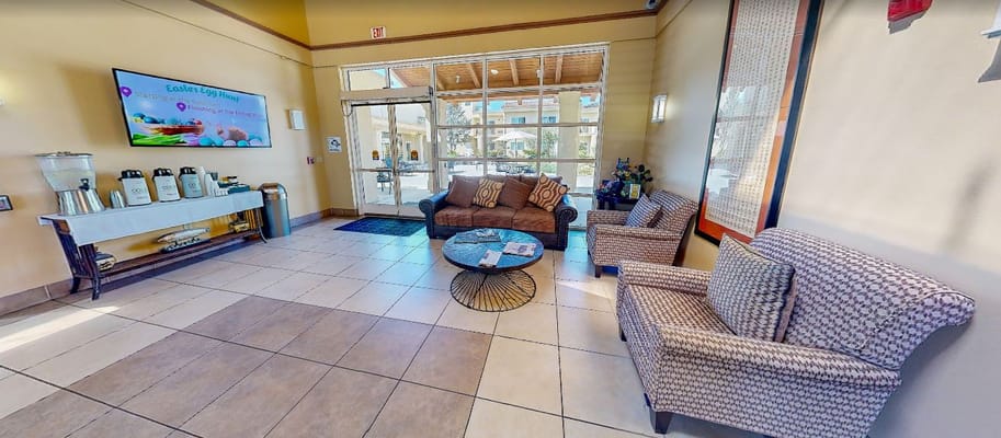 Bright lobby area with comfortable seating and decor
