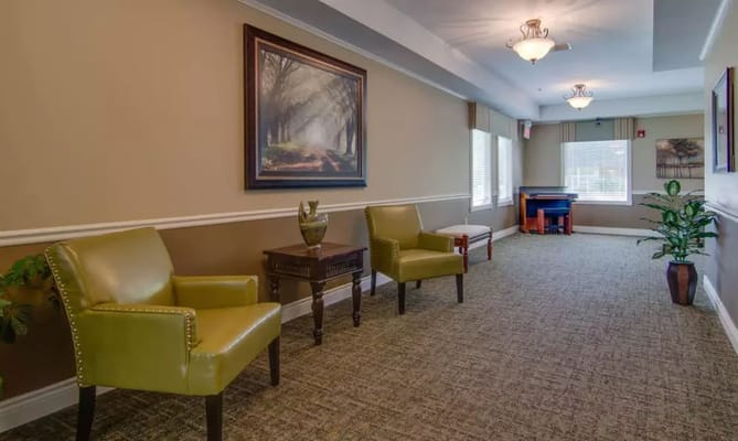 Interior hallway with chairs and artwork