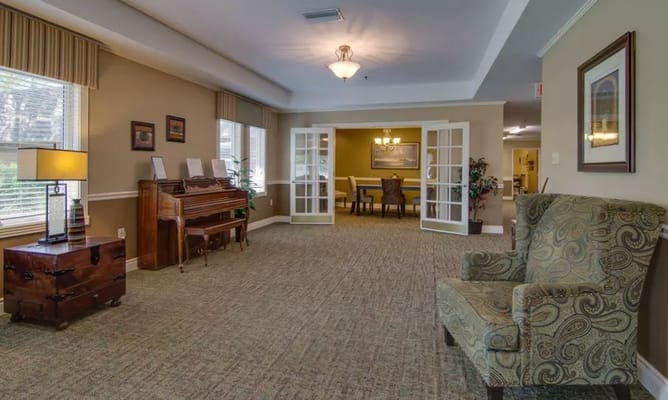 Interior view of a common area with seating and a piano