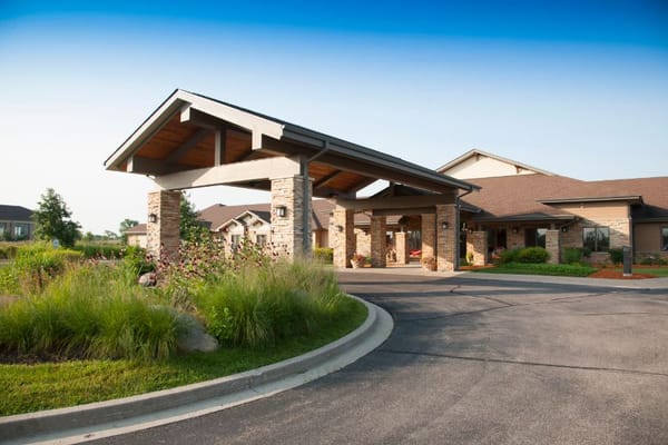 Main entrance with a covered porch and landscaping at NorthPointe Terrace.