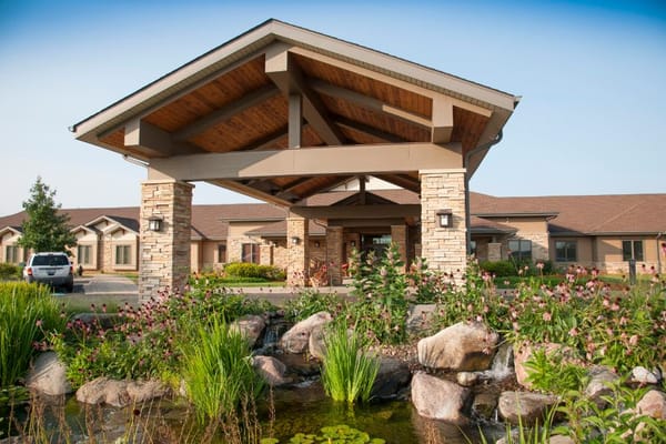 Entrance of NorthPointe Terrace surrounded by landscaping and water features