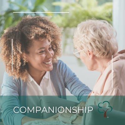 Two women smiling and engaging in conversation