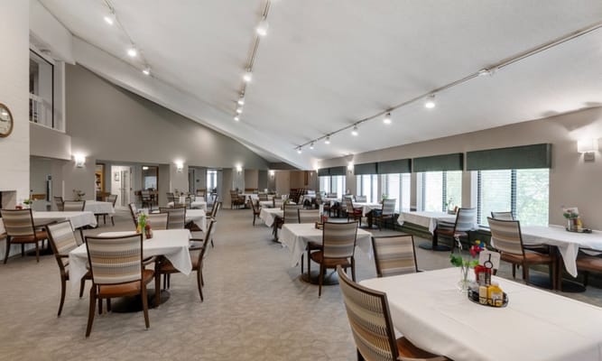 Spacious dining area with tables and chairs at Oak Hill Terrace