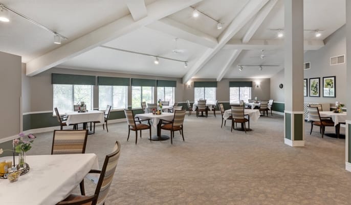 Bright dining area with tables set for meals