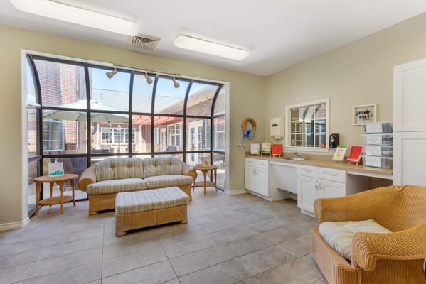 Bright common area with seating and natural light