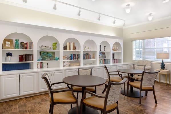 Interior view of a common area with shelves and seating