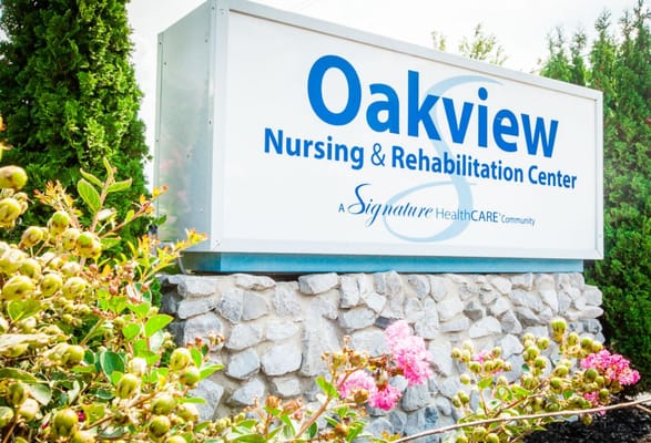 Signage for Oakview Nursing and Rehabilitation Center surrounded by landscaping