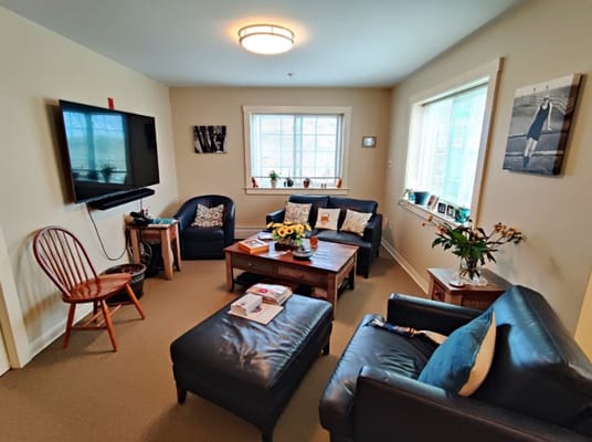 Bright common area with comfortable seating and decor