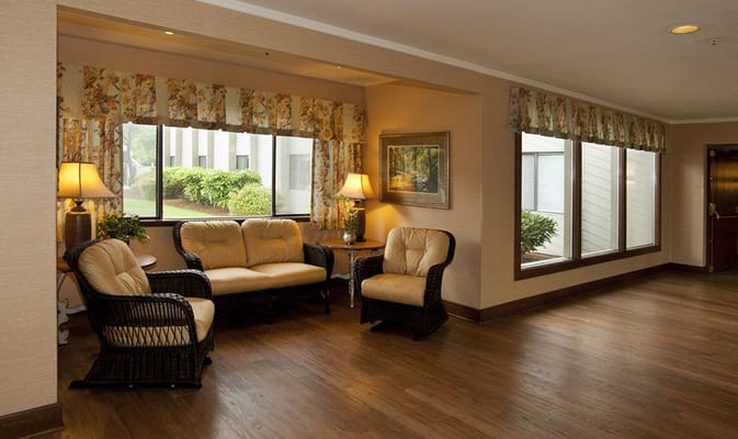 Lounge area with comfortable seating and large windows