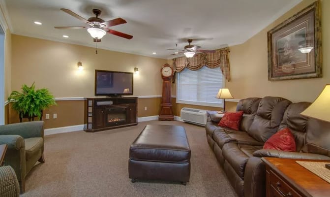Cozy living room with leather sofas and a television