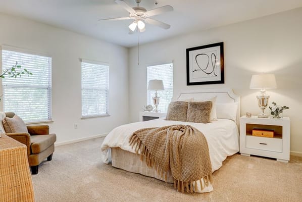 Cozy resident room with bed and seating area