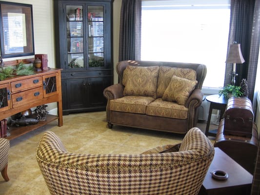 A cozy living room with comfortable seating and decorative accents.