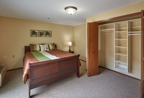 Cozy bedroom interior with a neatly made bed