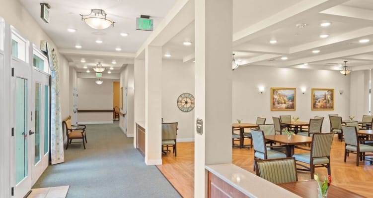 Dining area with tables and chairs in a well-lit interior