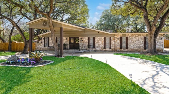 Exterior view of a senior living facility with landscaped grounds