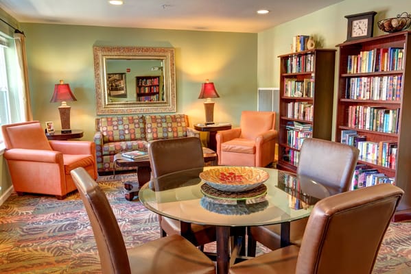 Cozy common area with seating and bookshelves