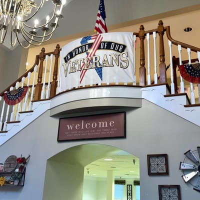 Welcome sign in a decorated common area for veterans