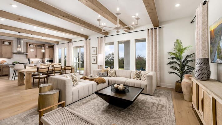 Bright living room with modern furnishings and a dining area