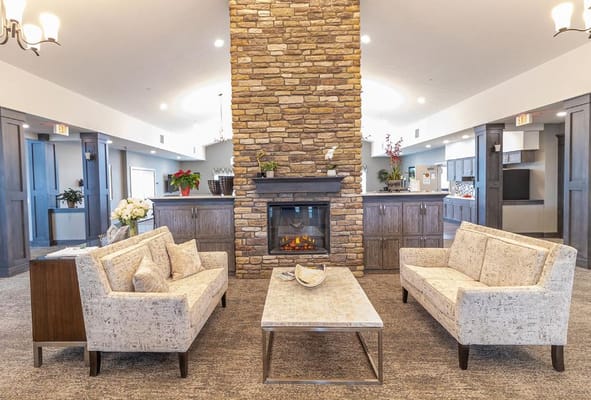 Comfortable living room with stone fireplace and seating area