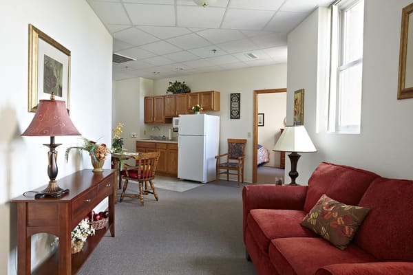 Cozy living room and kitchen space in River View facility