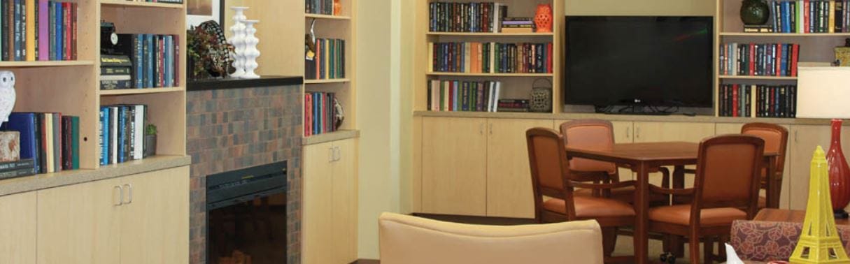 Inviting library space with bookshelves and seating area