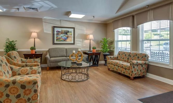 Comfortable living room area with colorful furniture and natural light.