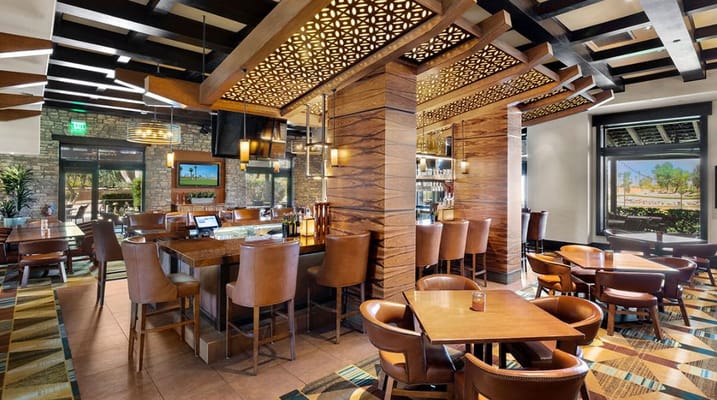 Elegant dining area with wooden accents and seating